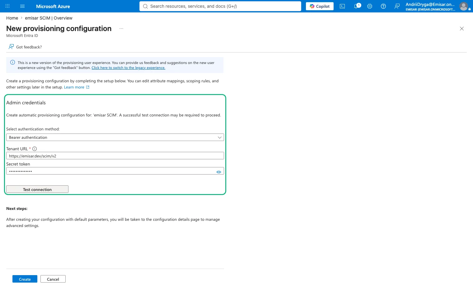 Entra's New provisioning configuration form for the emisar SCIM enterprise application, its Admin credentials block outlined in green: Select authentication method set to Bearer authentication, Tenant URL filled with https://emisar.dev/scim/v2, a filled but masked Secret token field, a Test connection button, and an enabled Create button below — Entra enables Create only once the test has passed.